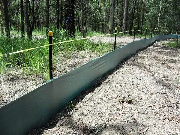 a silt fence is a temporary sediment control device used on construction sites to protect water quality